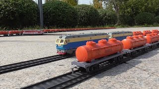 So Many HO Scale 3 Dome Oil Tanker Wagons Collecting From Railway Station And Preparing To Depart