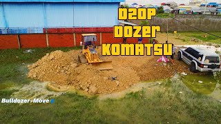 Pushing Stone soil Fill-in flood Land Project area, ByD20P Dozer KOMATS'U & 5T Truck uploading Stone