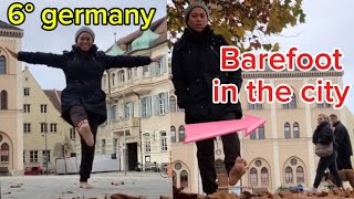 Barefoot in the city in autumn season in germany / city walking tour / window shopping