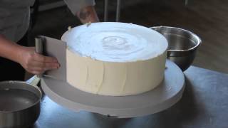 Watch Cake Artist Kaysie Lackey utilize the TTE to get perfectly sharp edges on her Buttercream!