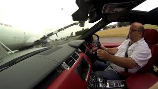 Driving Range Rover Sport Through The Belly Of Boeing 747 Plane