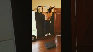 Fat man tries chest to bar pull ups