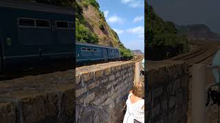 150216 and 150247 pass Teignmouth seawall