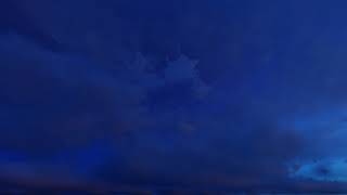 ( CGI 4k Stock Footage ) Dark blue night clouds on stary sky time lapse seamless loop