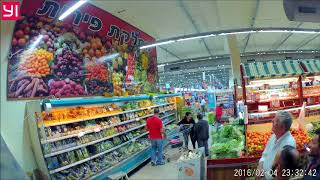 Quadcopter with ad hovering over customers in Rami Levy Hashekma Supermarket.