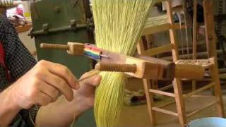 Stitching a broom in a hand clamp