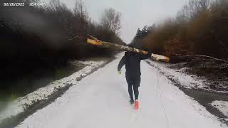 log carrying trail run in the snow