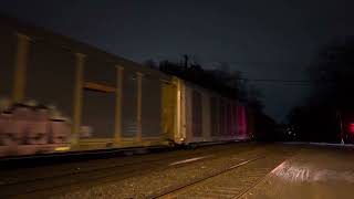 CSX 809 ES44AH leads CSX M218 with a friendly crew at Piscataway