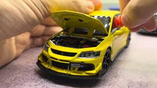 MINIATURA  MITSUBISHI LANCER EVOLUTION PRETO 1/32 SOM.  R$209,00.                 #LancerEvolution#