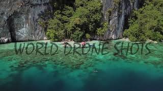 Drone shot of a woman snorkeling in the coral reef near limestone cliffs in Ora Beach in Maluku 4k