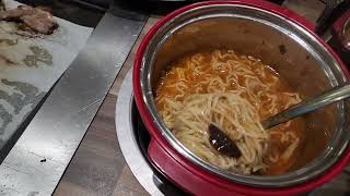 Tom yam soup with seafood and white noodles