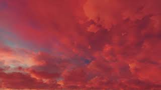 ( CGI 4k Stock Footage ) Fiery hot red sunset clouds time lapse seamless loop