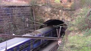 A UID Class 318 and 320319 depart Glasgow Queen St.