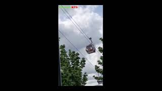 Arian and Zayan at cable car. Thames river . London.