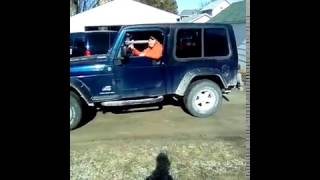 2006 jeep LJ peeling out.