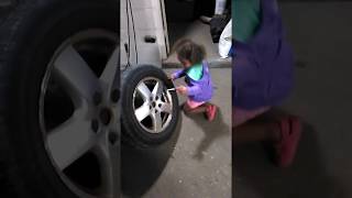 Jr. Amsoil dealer changeing her moms tires.