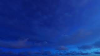 ( CGI 4k Stock Footage ) Dark blue night clouds on stary sky time lapse seamless loop