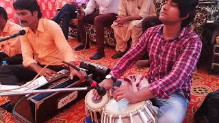 Suneel Gill playing Tabla with worshiper Stephen Anwar.