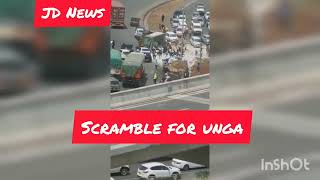 Drama along Mombasa road as Kenyans scramble for Unga after a trailer lose control and overturns!!!