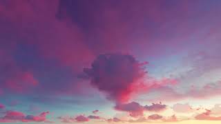 ( CGI 4k Stock Footage ) Pink red dramatic sunset fiery dreamy fantasy clouds seamless loop