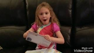 an excited 6 year old gets surprised with her first passport