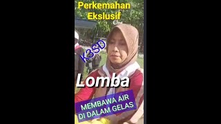 MEDALI EMAS K3SD PADA LOMBA MEMBAWA GELAS BERISI AIR DI ATAS JILBAB