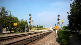 HD: Metra F40C 611 leads an outbound Express train by Milwaukee Road Searchlights at Bensenville Il.