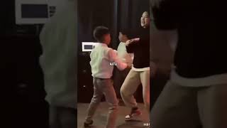 the girl dance with cute little boy