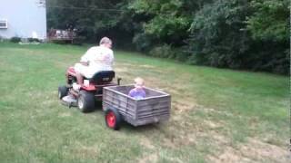 Grandpa giving Christian a trailer ride for the first time