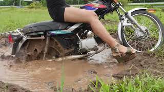 Beautiful girl stuck in mud spinning wheel destroying shoes