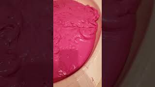 Neon pink slime at sloomoo institute.