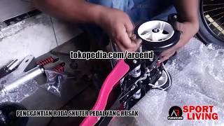 Penggantian roda belakang skuter pedal injak