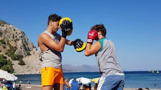 boxing mitts on the beach