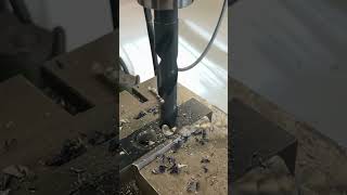 slow motion drilling without lube and no pilot hole 1 1/8” and .006” feed rate