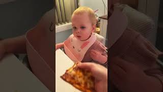 Baby eats pizza for the first time😭🤌🏻