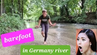 Barefoot in the river in Germany after wandering around the city