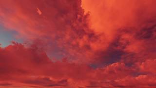 ( CGI 4k Stock Footage ) Fiery hot red sunset clouds time lapse seamless loop