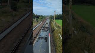 Class 390129 'City of Stoke on Trent' flashes past German Lane Footbridge