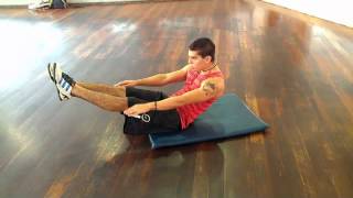 V-sit en suelo en equilibrio - NotaFitness.com