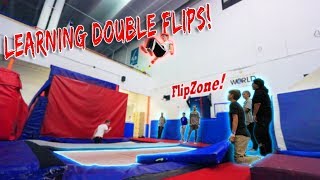 LEARNING MY FIRST DOUBLE FLIPS! *super trampoline*