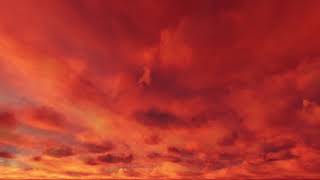 ( CGI 4k Stock Footage ) Fiery hot red sunset clouds time lapse seamless loop