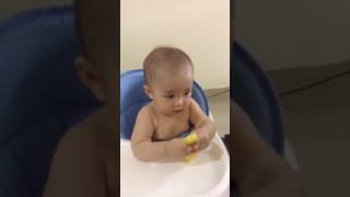 Baby is eating green mango ( 8 months 23 days old)