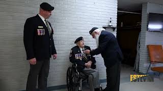 WWII Veteran Jim Spenst receiving the first poppy for Estevan's poppy campaign