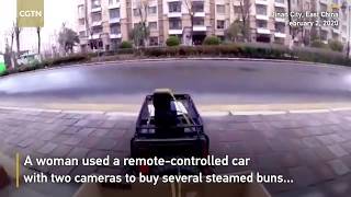 Woman uses remote control car to buy food in east China