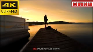 🎁4K A teen fishing with a pole off a dock at sunset | DAILY NATURE FOOTAGE