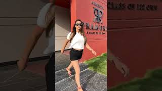 Indian Girl outside a theatre Pramukh A class of | Black shorts | White Top | Goggles