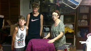 Grandma, Grandsons, and Staple Gun to Cover a Chair Cushion Base!