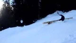 Snowboarder falls on pipe