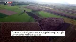 Drone footage shows thousands of refugees walking through Slovenia