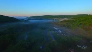 Flight down foggy valley